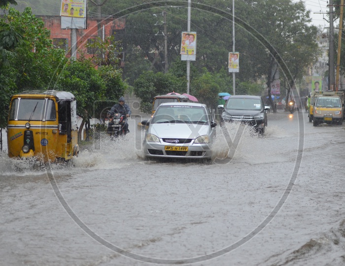 Cars in Water logged street, Cyclone Pedhai, Rain