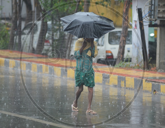 Man in Cyclone Pedhai, Rain