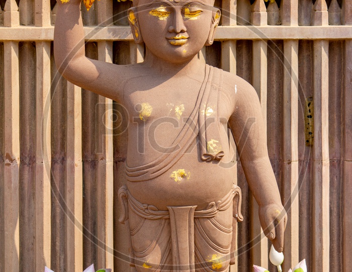 Buddha Statue as a kid at the Giant Buddha complex in Sarnath