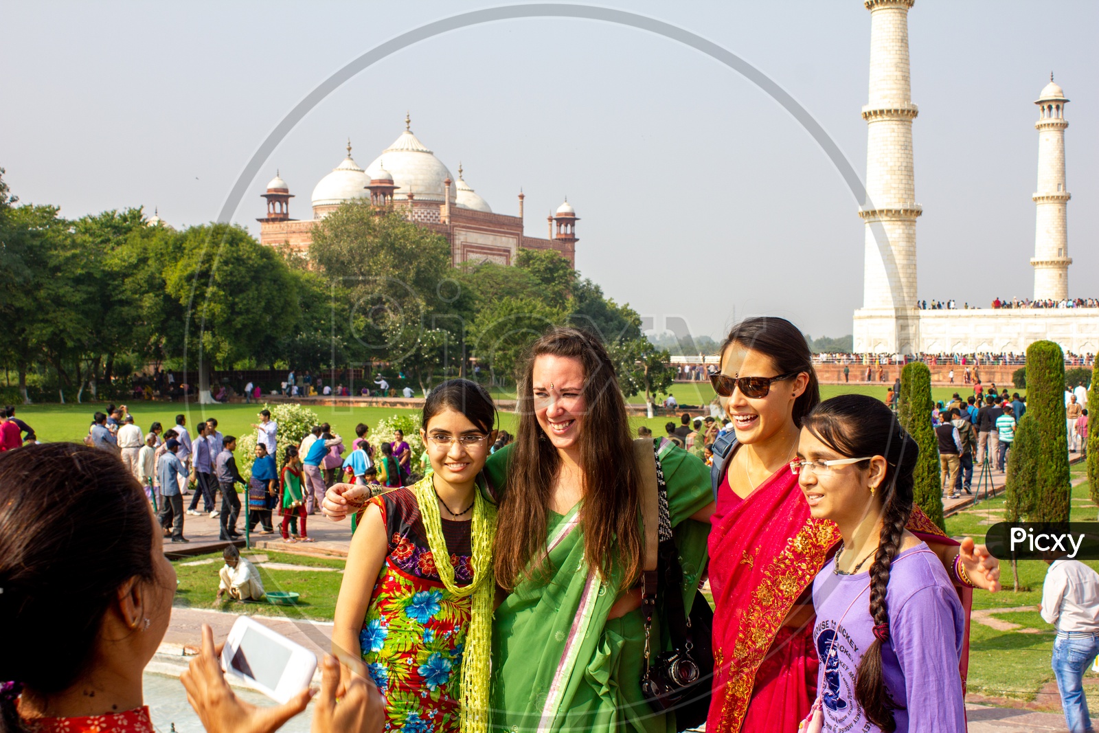 Indian People taking photographs with foreigners