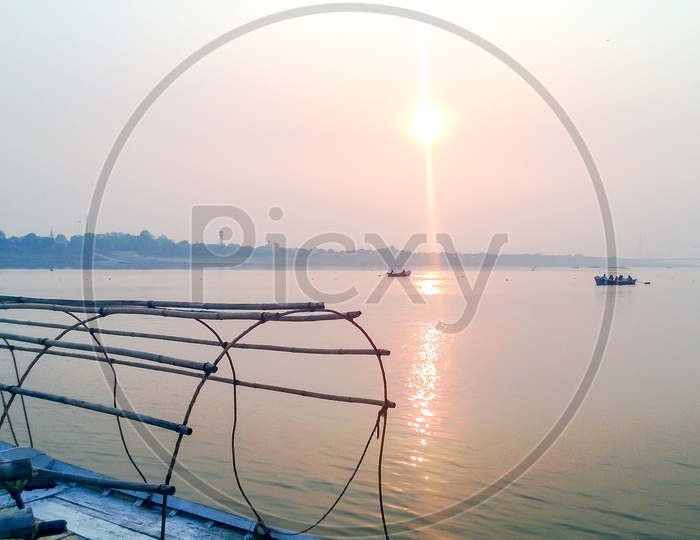 River Ganga with Boats and Sunlight in Varanasi