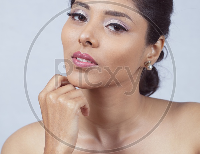 Indian smiling Female Model with White pearl Earrings