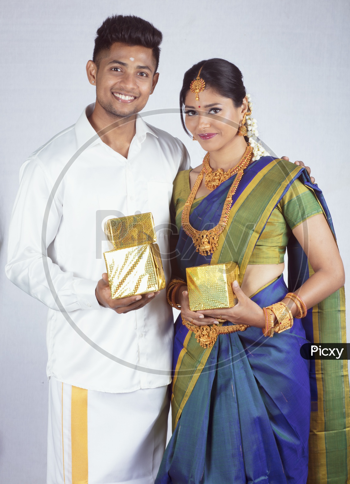 Traditional Indian Couple with Gifts- Man/Male, Female/Woman Models - White background