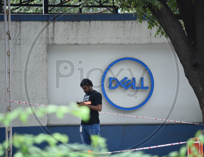 An IT employee Using Phone At Dell Office
