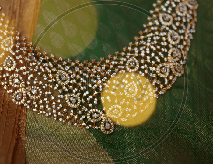 Choker Necklace In Green background - Indian Jewelry/Gold Ornament - Close up