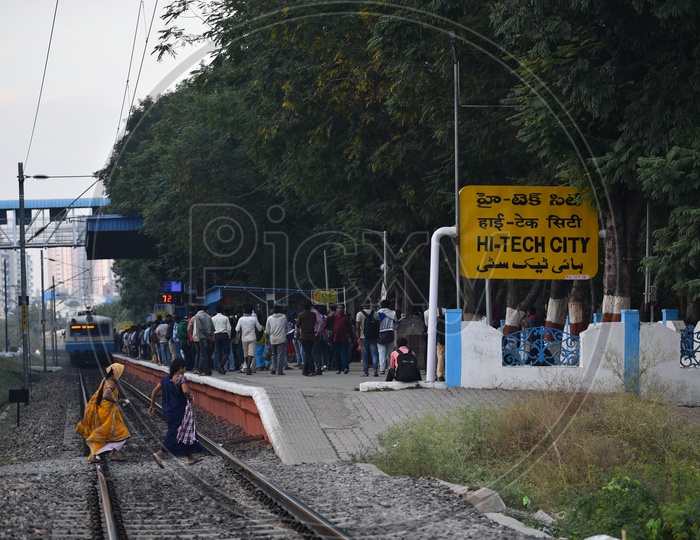 Women on the tracks at Hi-Tech City Railway station to catch the Train