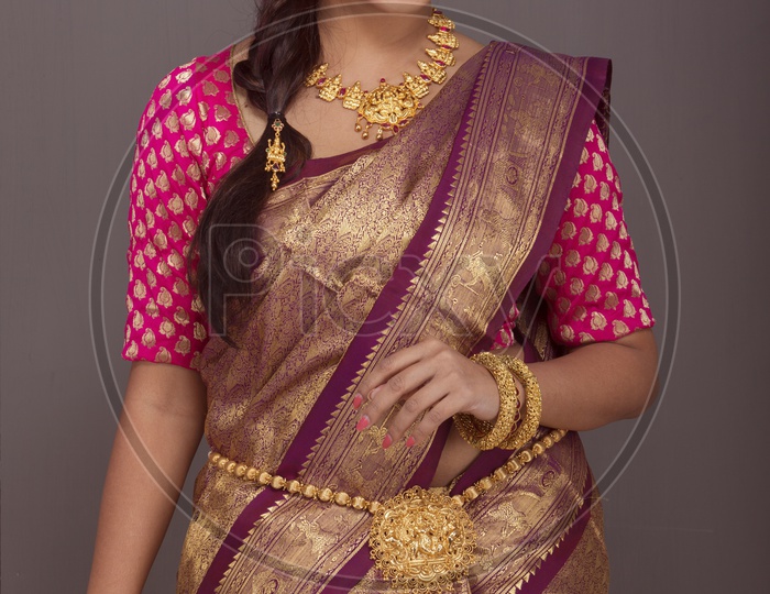 Indian Bride dressed up in red saree portrait in Studio Lighting