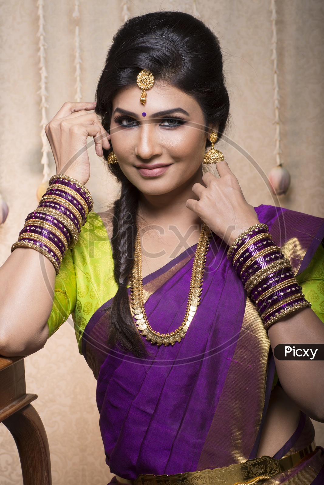Traditional Indian Female/Woman Model in Purple Saree, green Blouse