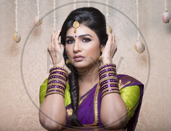 Traditional Indian Female/Woman Model in Purple Saree, green Blouse
