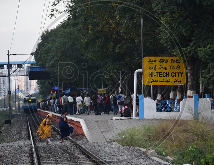 Women on the tracks at Hi-Tech City Railway station to catch the Train