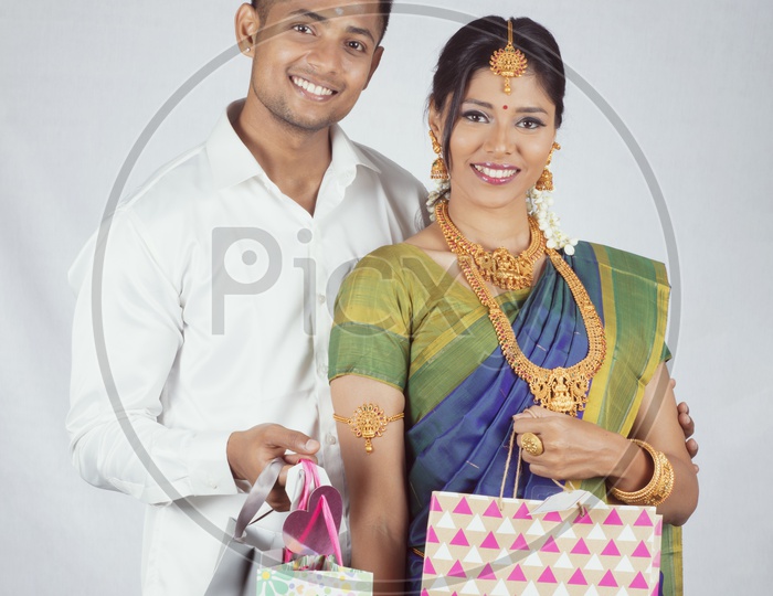 Traditional Indian Couple with Gifts- Man/Male, Female/Woman Models - White background