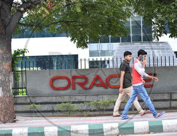 IT Employees Walking in Foothpath at Oracle Office