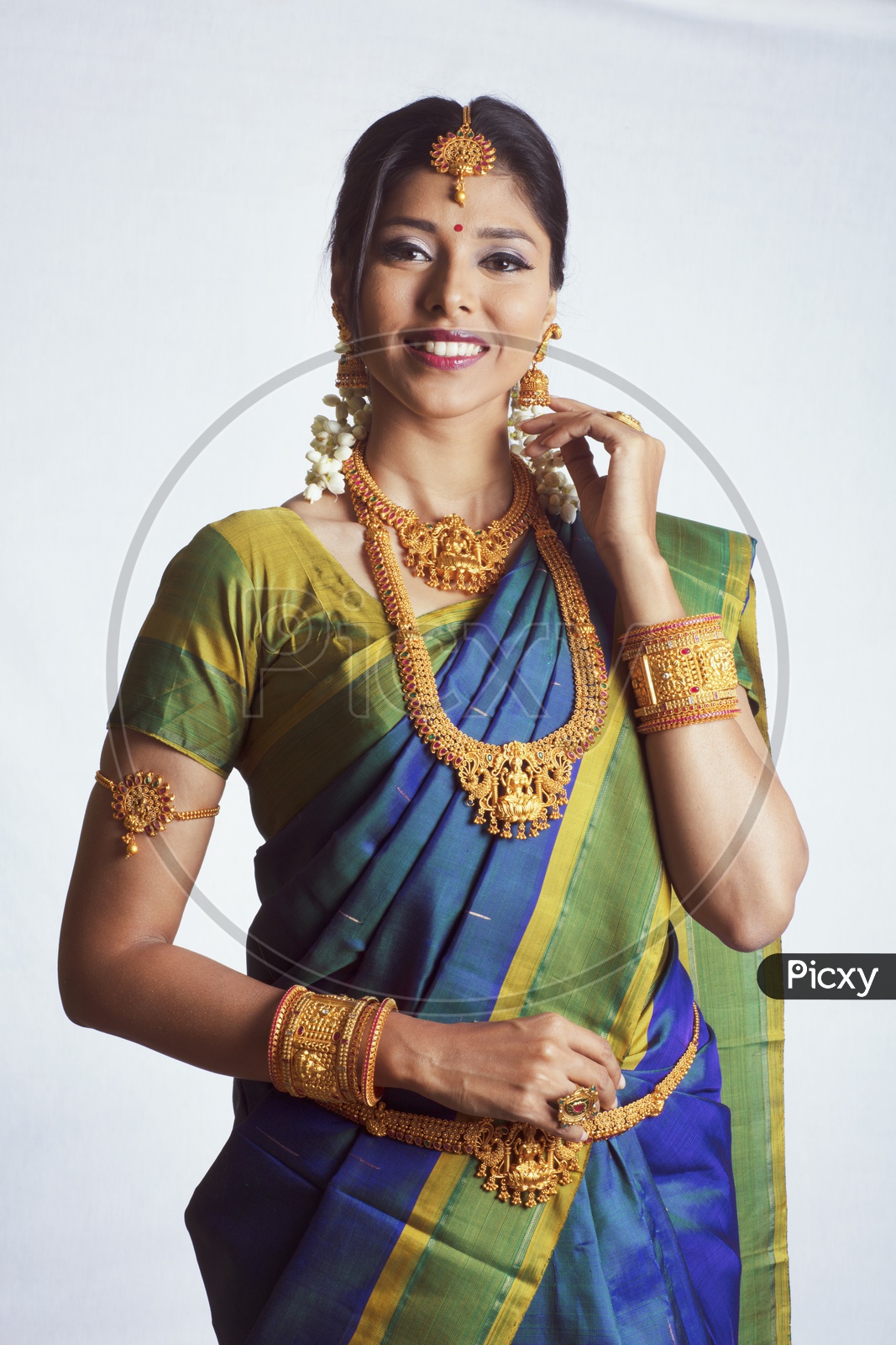 Plain chiffon parrot green saree with a dark blue golden patch blouse  paired with a golden earrings. | Choli blouse design, Fashion outfits, Saree  look