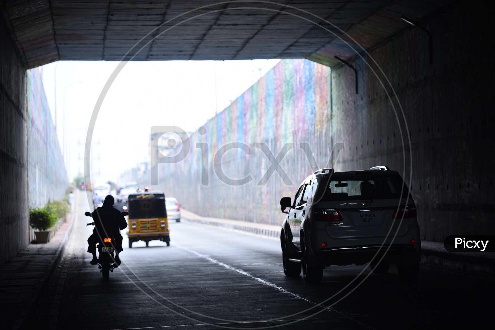 Silhouette of Vehicles Passing By a Underpass in Hyderabad