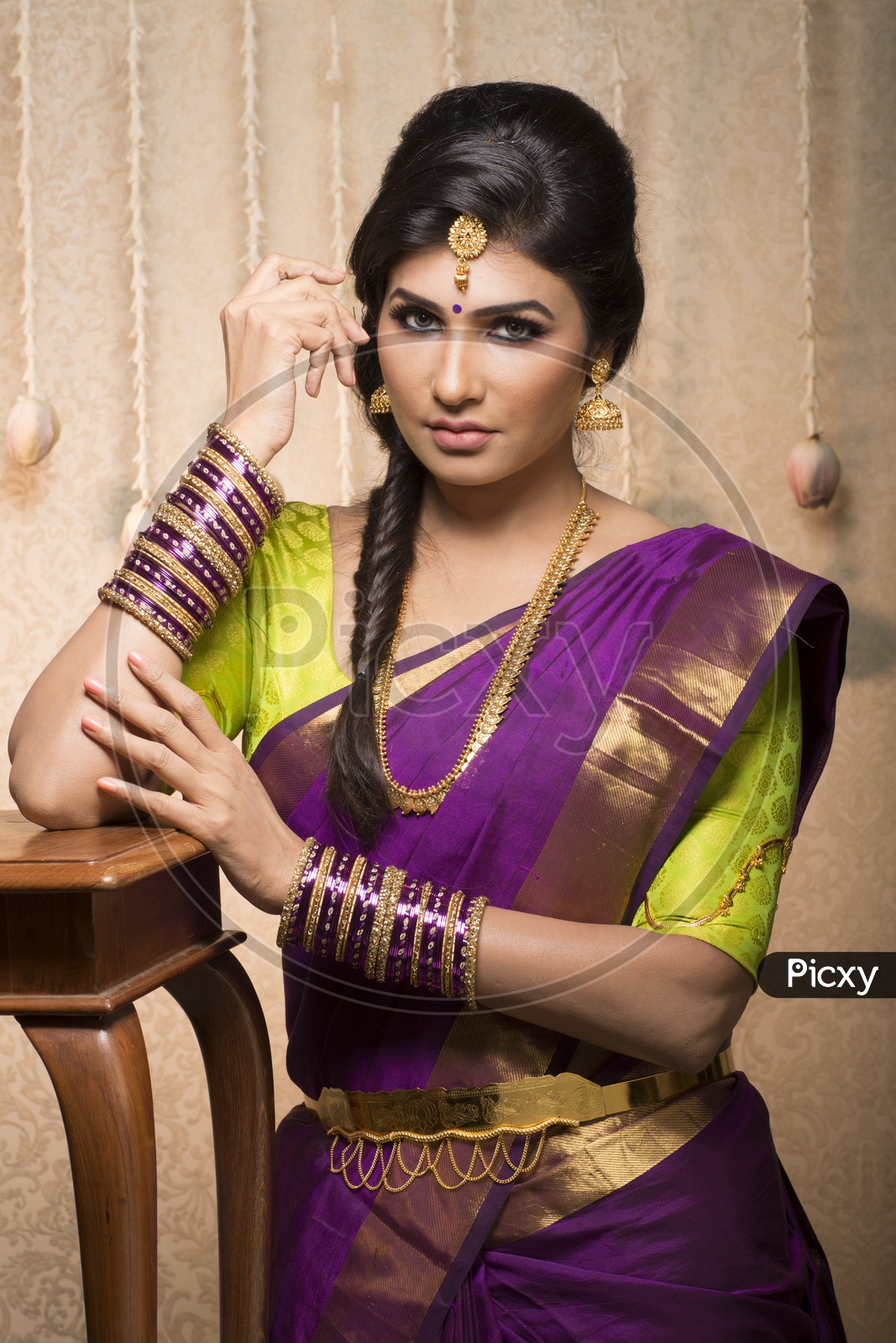 Traditional Indian Female/Woman Model in Purple Saree, green Blouse  - Smiling