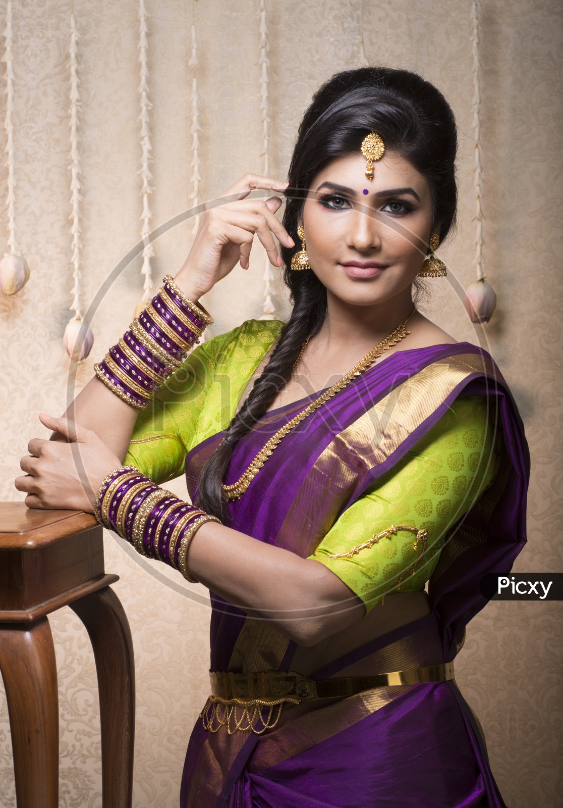 Traditional Indian Female/Woman Model in Purple Saree, green Blouse  - Smiling