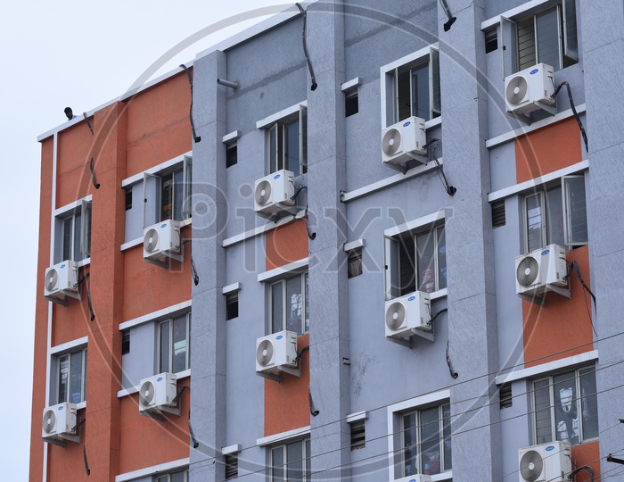 Air Conditioner Compressors Fixed to the Windows in an apartment in Hyderabad