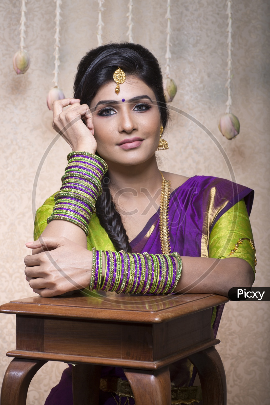 Traditional Indian Female/Woman Model in Purple Saree, green Blouse - Smiling