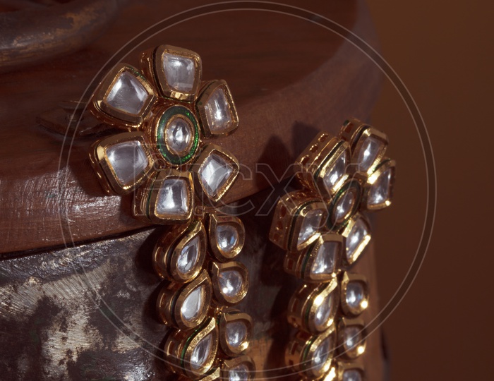 Diamond  Ear Rings Set  / Jewelry Closeup Shot on an Wooden Background