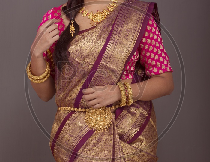 Indian Bride dressed up in red saree portrait in Studio Lighting
