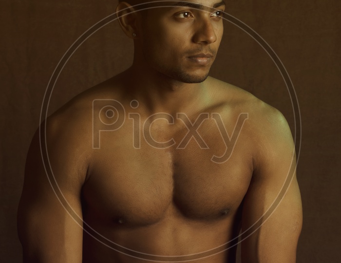 Young bodybuilder showing chest muscles in front pose Indian Body Builders  Association show, Balewadi, Baner, Pune Maharashtra India Stock Photo -  Alamy