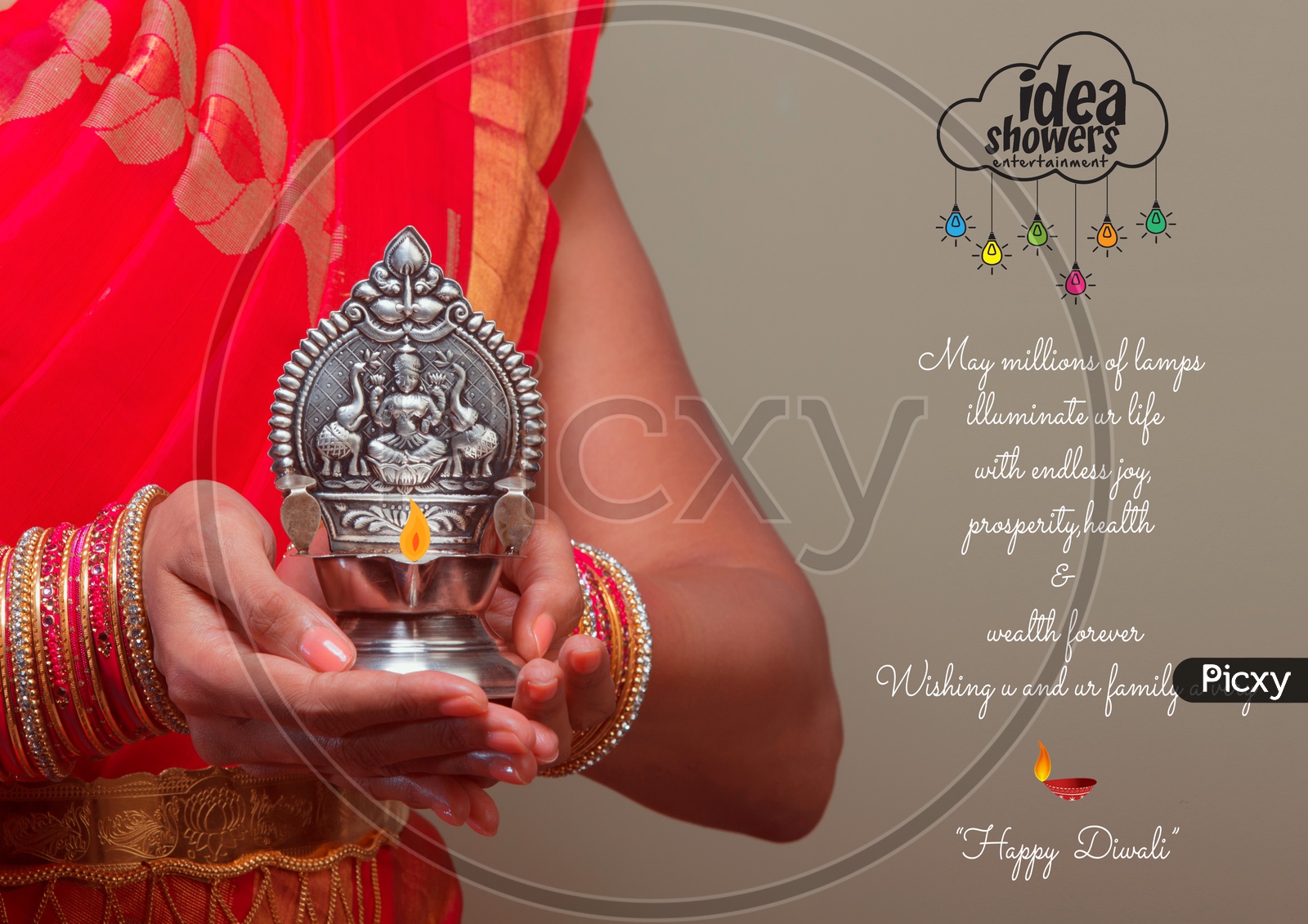 A Beautiful Indian Female Model  in Traditional Attire Wearing a Saree and Jewelry  With a Traditional Silver Oil Lamp In Hands  with Space  Closeup Shot