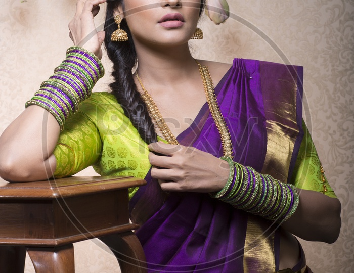 Traditional Indian Female/Woman Model in Purple Saree, green Blouse - Posing