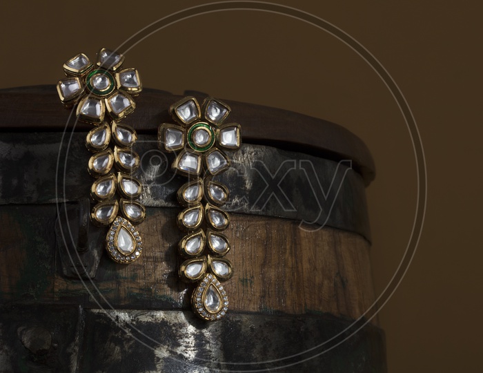 Diamond  Ear Rings Set  / Jewelry Closeup Shot on an Wooden Background