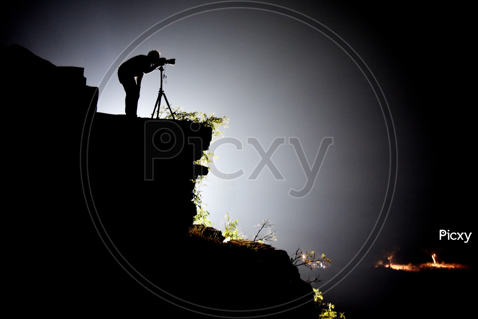 A Photographer Silhouette on a Hill top