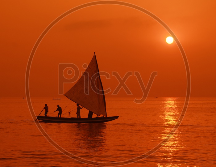 Indian Boat Sailing Silhouette With a Beautiful Sunset in Background