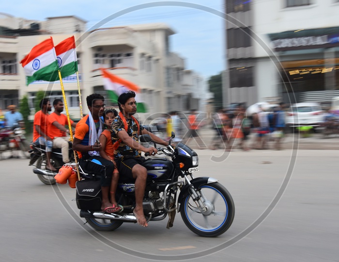 Pilgrims Travelling By Bikes With Indian Flag in Haridwar
