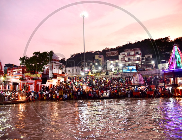 Indian Hindu Devotees at the Bank Of river ganges and Waiting For the Holy Aarthi / Harathi in Haridwar