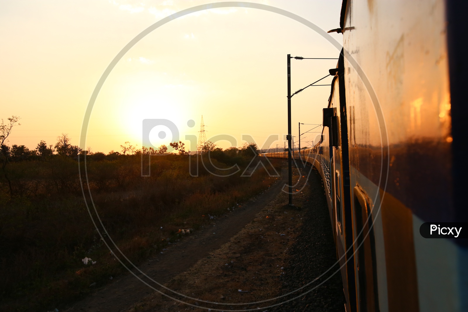 A Beautiful Sunset Shot From a Moving Train with Track and train Composition