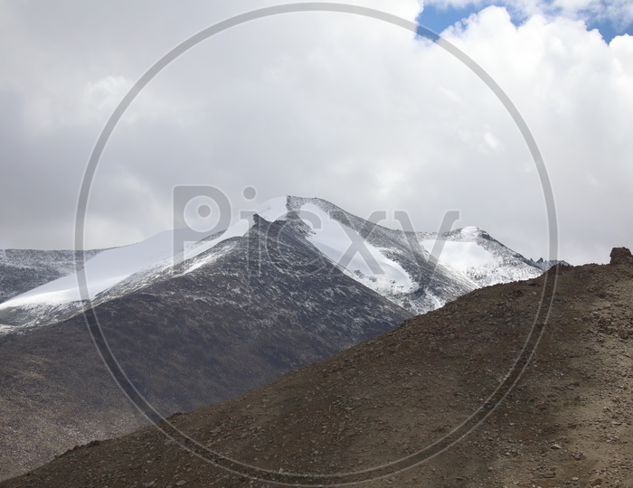 A Beautiful View Of Leh With Mountains , Valley and Blue Sky With Clouds