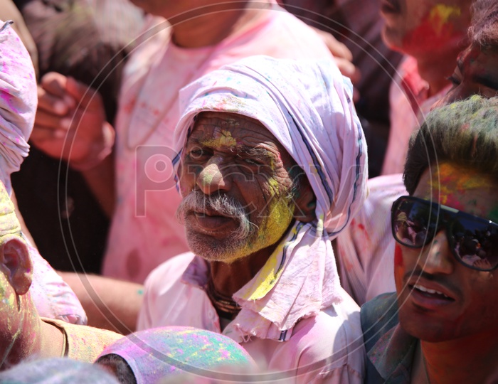 People celebrating holi in streets of Barsana