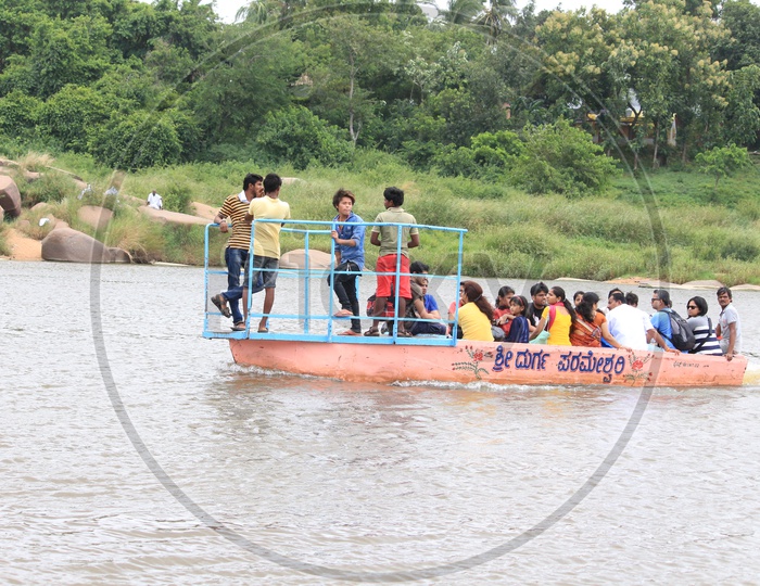 People traveling in a Boat in Hampi