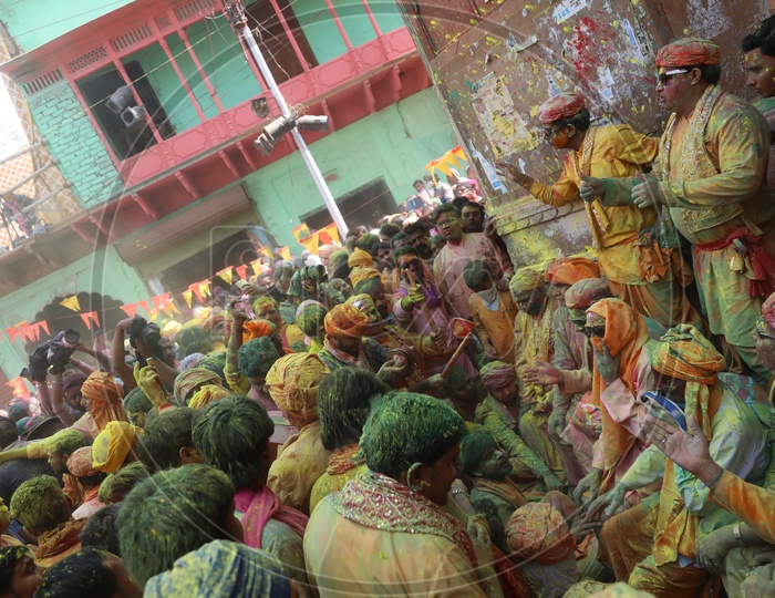 People celebrating Holi in streets of  Barsana,Uttar Pradesh, India