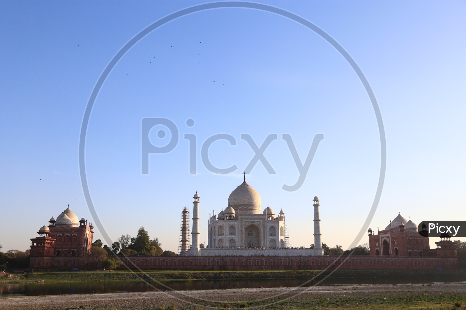 Beautiful View Of Taj Mahal With a Sunset and Blue Sky In Background