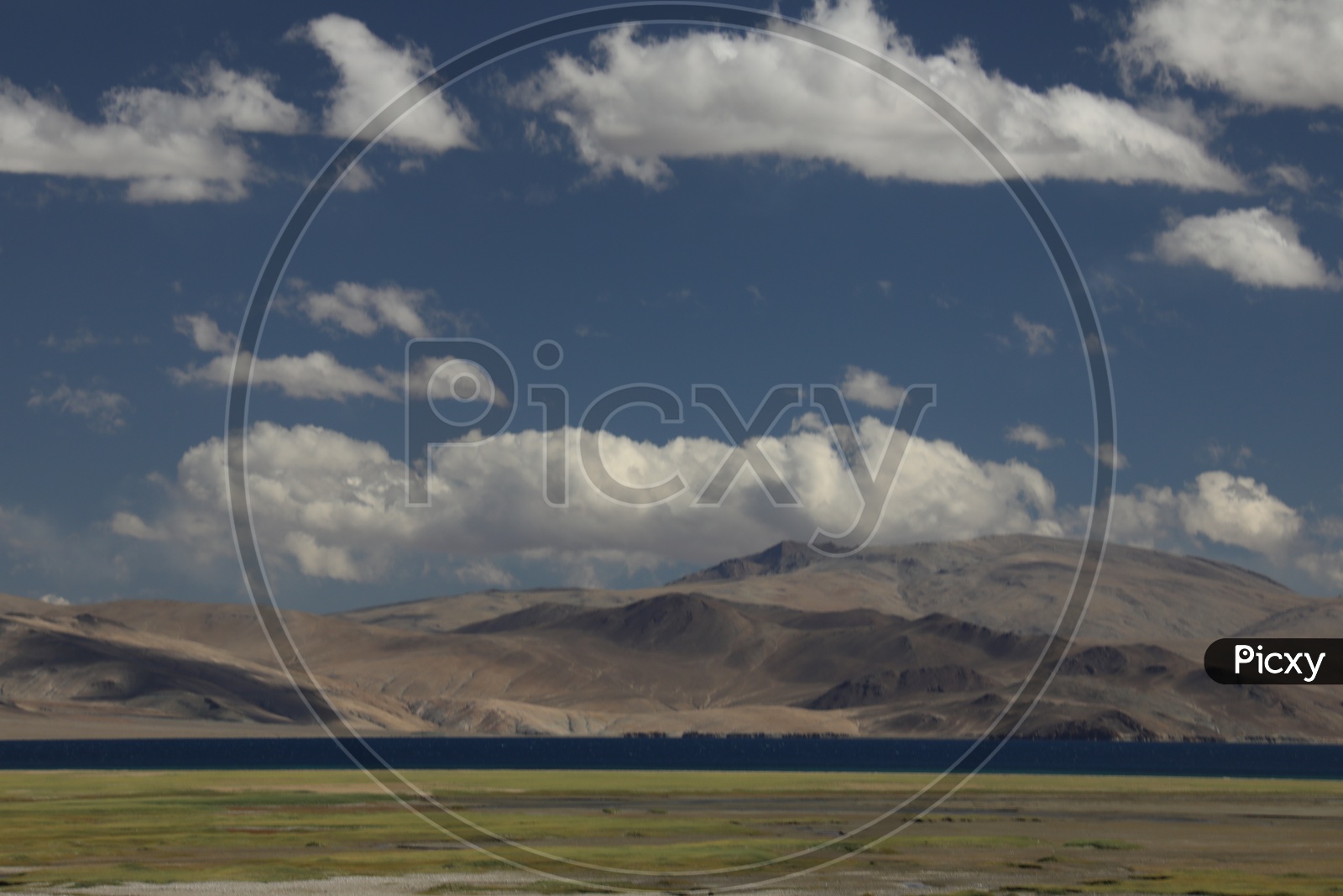 A Beautiful View Of Leh With Sand Dunes , River Valley and Blue Sky  With Clouds