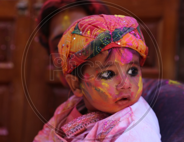 Baby boy with Colors/Colours on face - Holi/Indian Festival - Festival of Colors