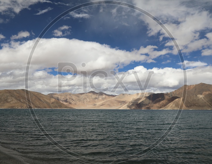 Beautiful Landscape of Snow Capped Mountains with lake in the foreground, Leh