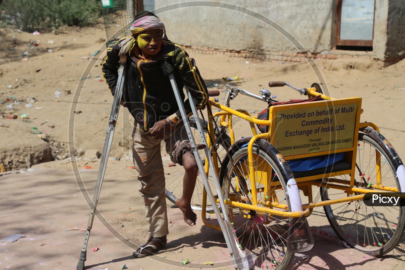 handicapped man celebrating holi  in Barsana