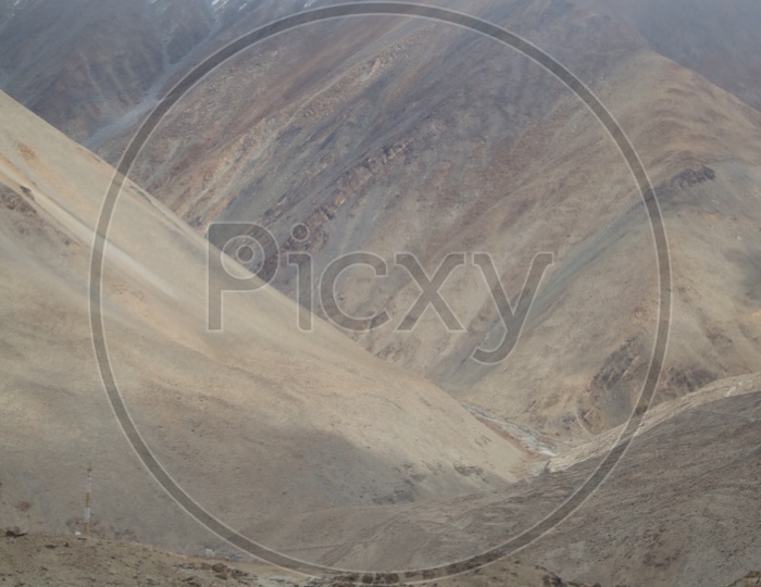 Roads in Leh / Ladakh with Sand Dunes and Mountains In Background