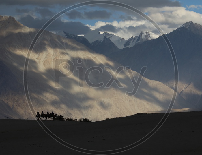 Beautiful Landscape of Snow Capped Mountains with huge clouds, Leh