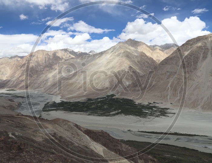 A Beautiful View Of Valleys in Leh With Mountains and Sky As Background
