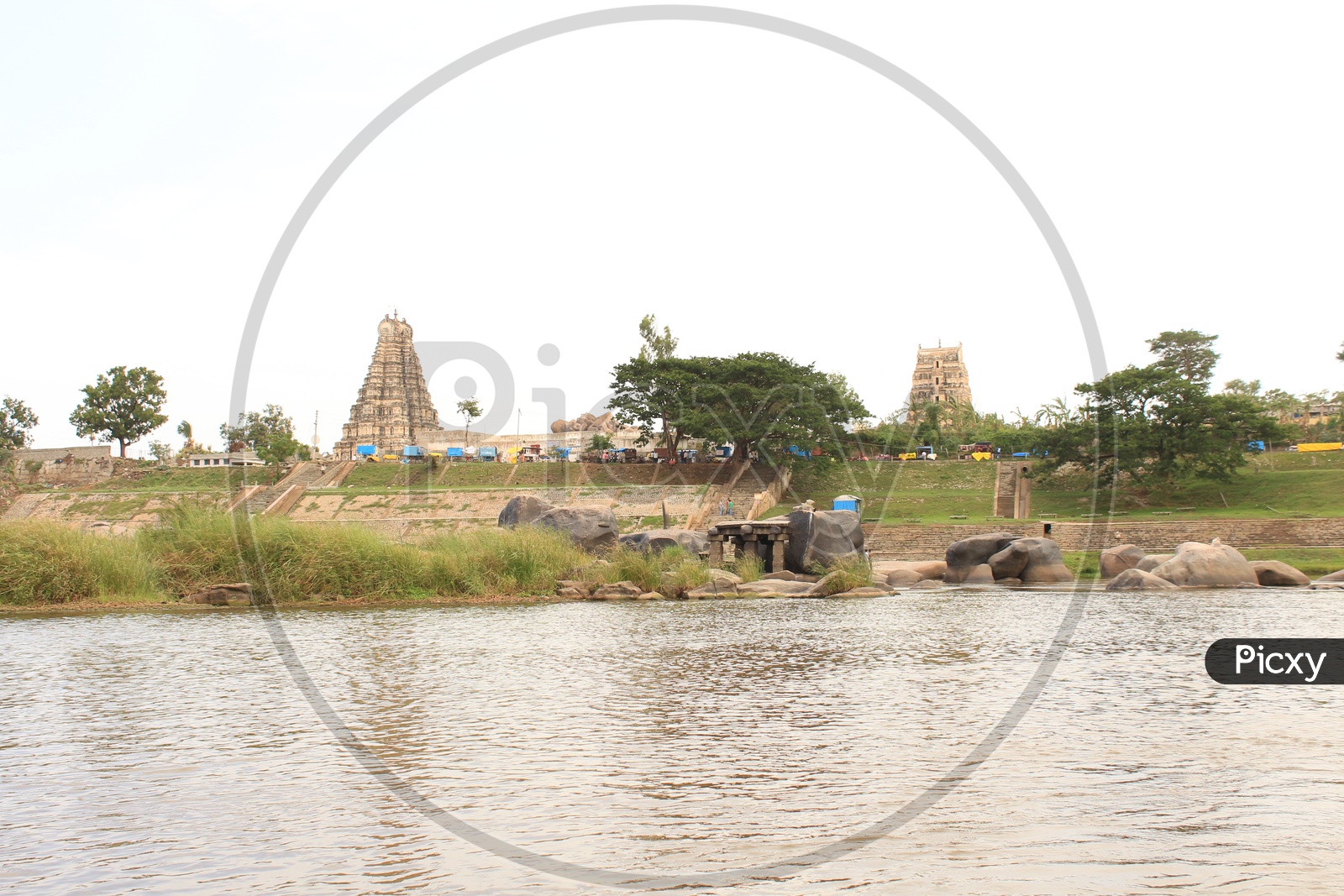 Temple with lake in the foreground in Hampi