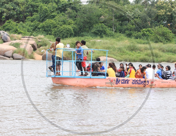 People traveling in a Boat in Hampi