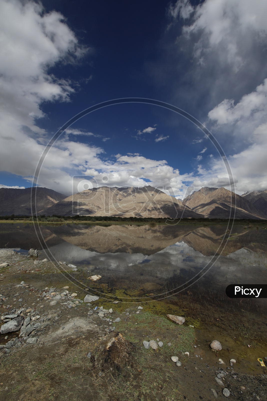 A Beautiful Reflection of Mountains in Water in River valleys of Leh