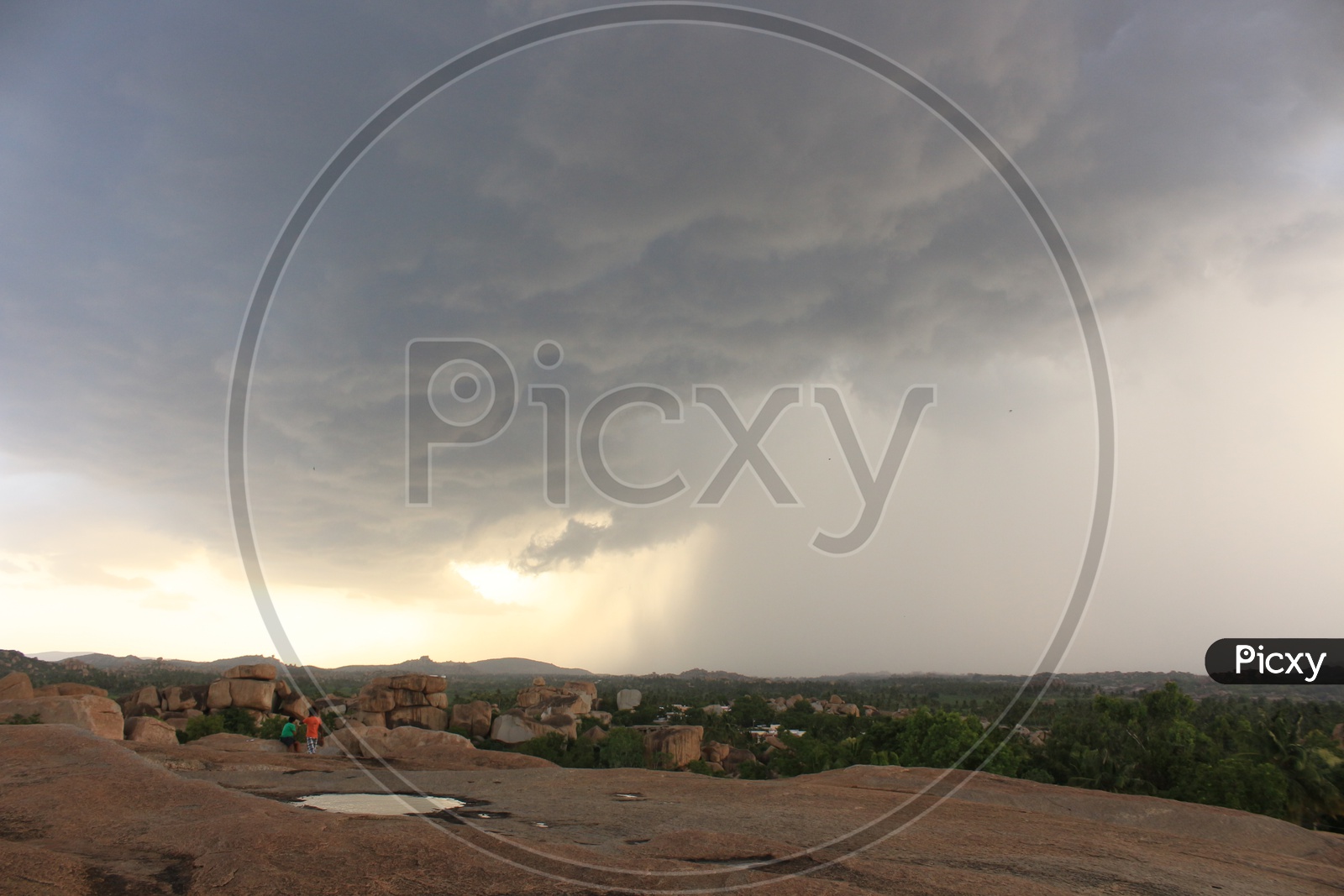 Landscape of Hampi with Huge clouds in the sky