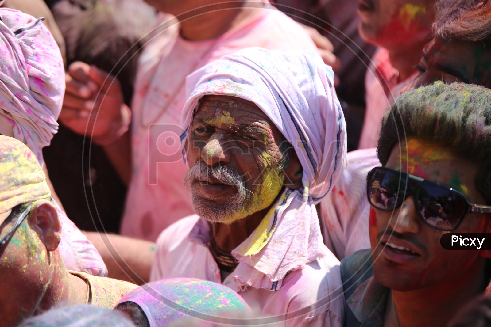 People celebrating holi in streets of Barsana